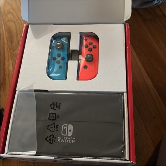 Nintendo Switch Console with Vibrant Blue and Red Controllers. Brand new - Picture 3 of 4